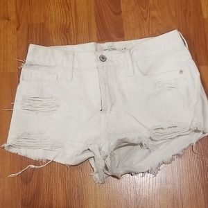 Distressed white denim shorts